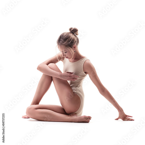 young beautiful dancer in beige swimsuit 