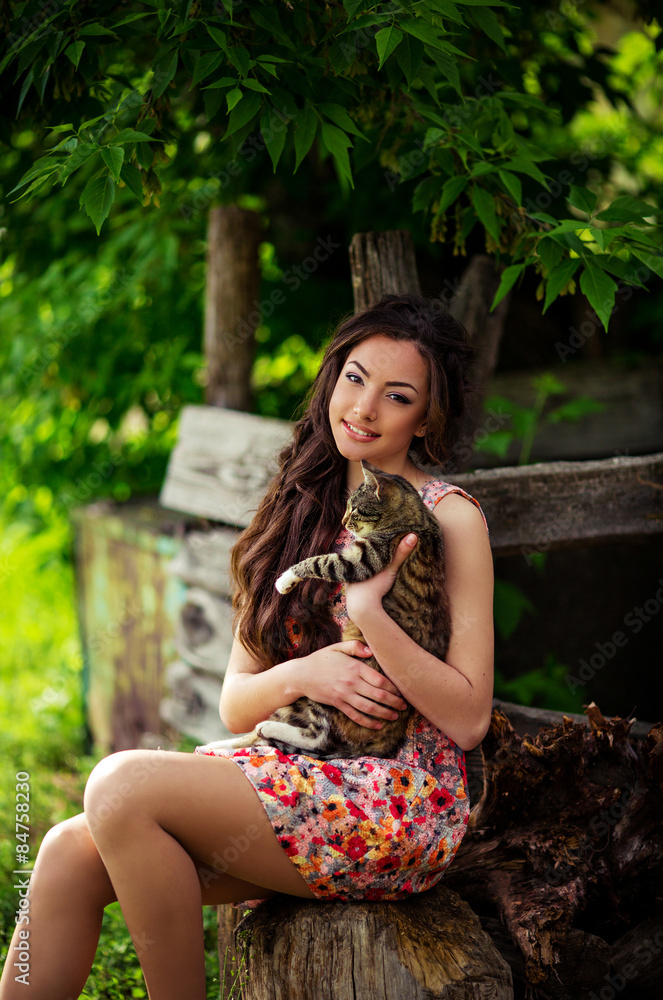 Naklejka premium Portrait of beautiful young woman with makeup in fashion clothes