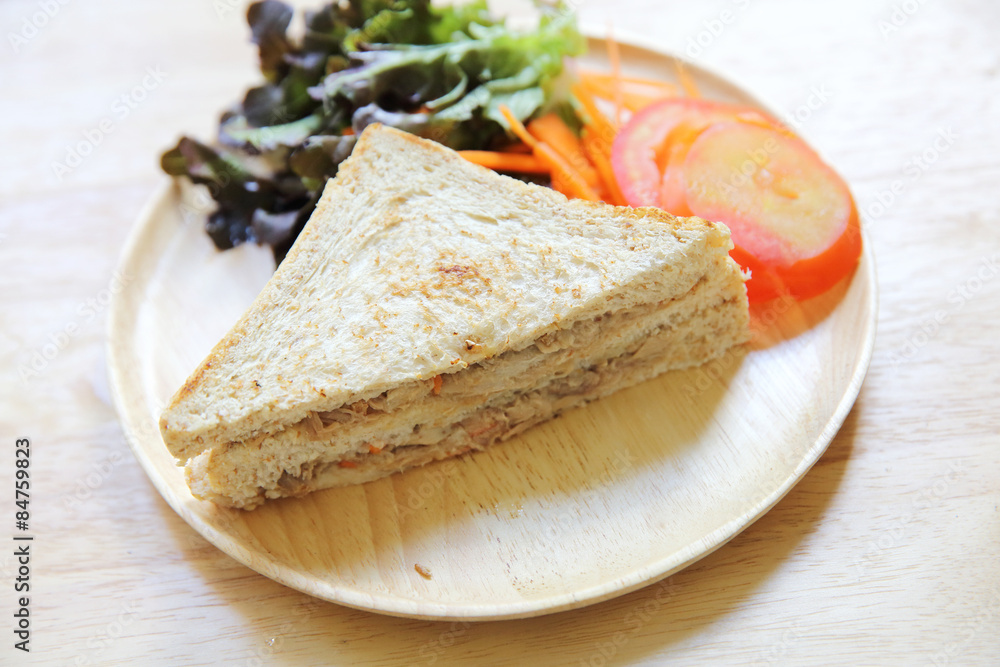 tuna sandwich on wood background