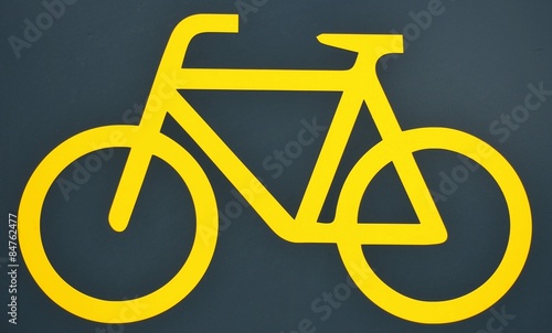 Yellow bike logo on black background.