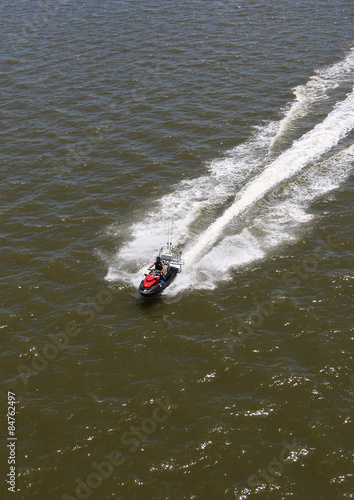 Man On Recreational Watercraft Crossing Gulf Coast