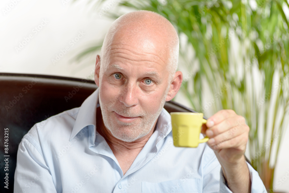 a middle-aged man drinking coffee a middle-aged man drinking coffee