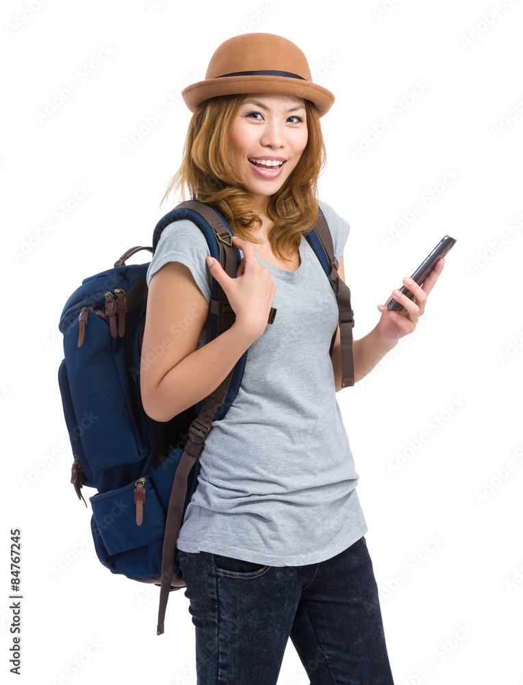 Asian young woman holding cellphone with backpack Asian young woman holding cellphone with backpack