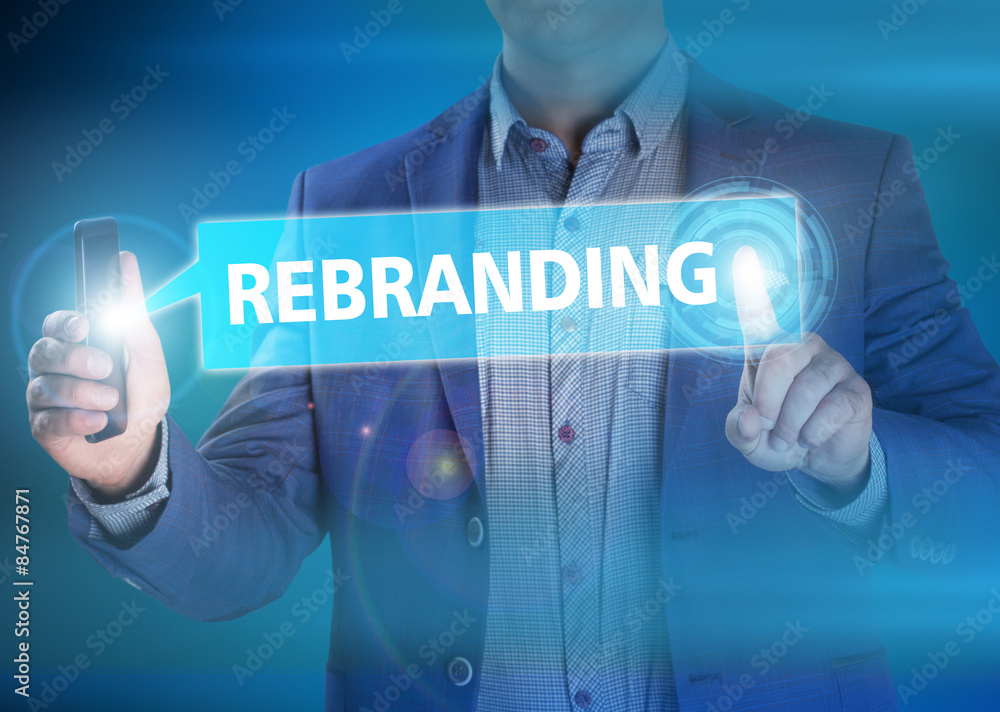 Businessman presses button rebranding on virtual screens. Busine Businessman presses button rebranding on virtual screens. Busine