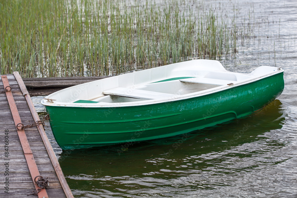 Green boat on a lake