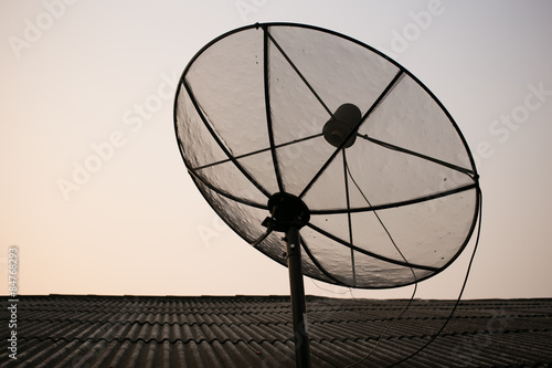 Satellite dish on the roof of rural house in Thailand.