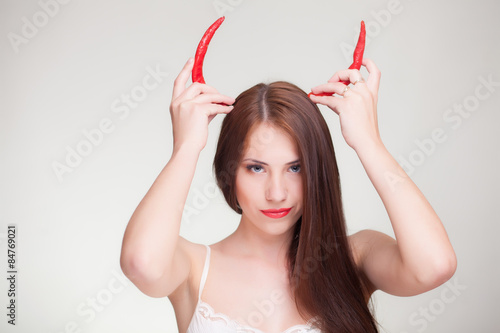 woman horned with chili peppers