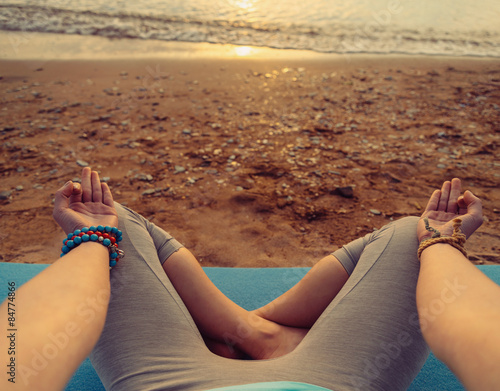 Photos POV image of woman meditating in pose of lotus