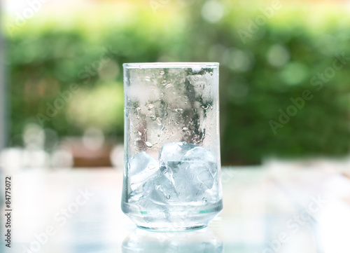 the ice cube in glass that out of water