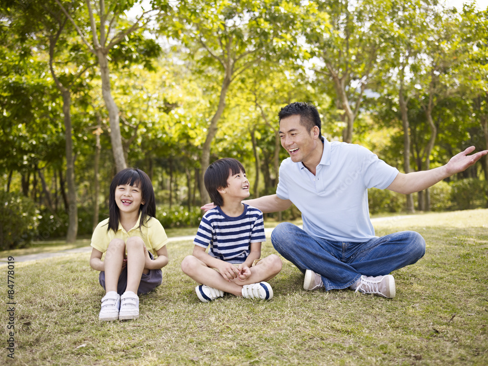 asian father and children having an interesting conversation asian father and children having an interesting conversation
