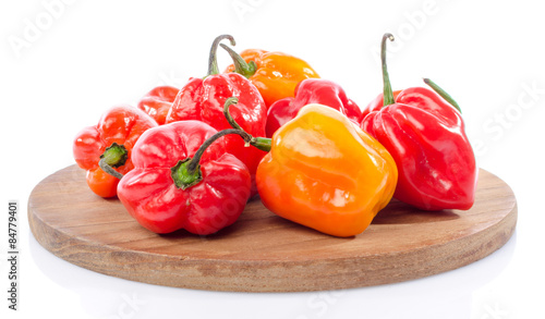 Fresh habanero peppers on cutting board photo