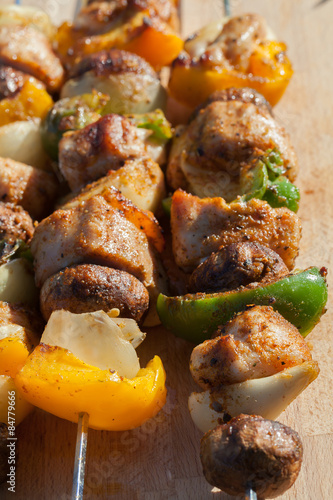 Grilled skewers with turkey, peppers and mushrooms. photo