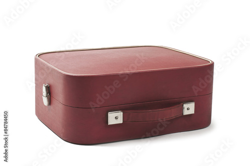 photo of an Old retro style red suitcase isolated on white background. Studio shot