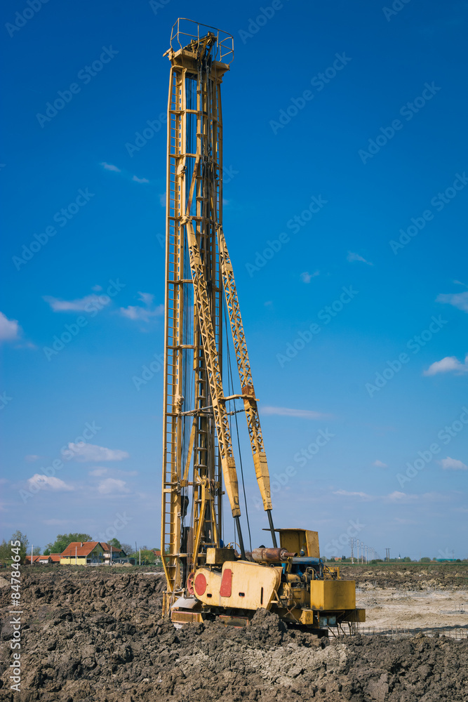 Pile driving machine in construction site