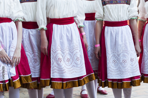 Girls in Slavonic national costumes  preparing for a dance performance. © bulashenko