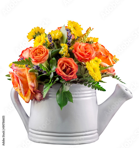 Vivid colored flowers, orange roses, watering can