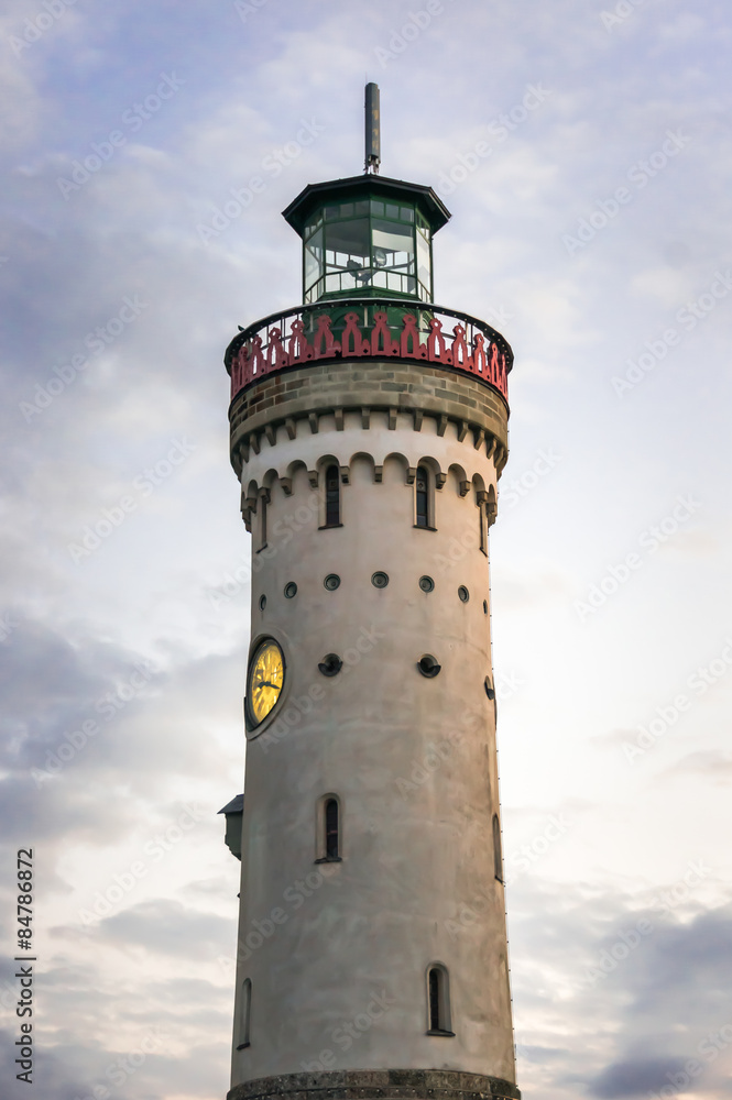 Mysterious lighthouse at evening in harbor of Lindau in lake Con Mysterious lighthouse at evening in harbor of Lindau in lake Con