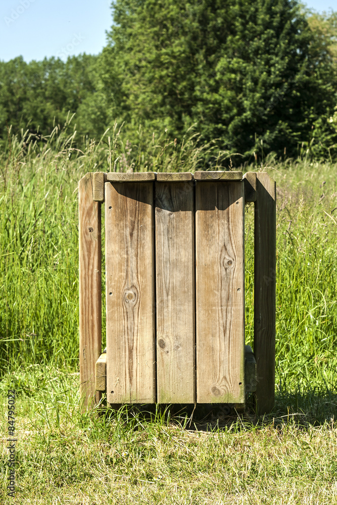 Fototapeta premium wooden garbage container in a park