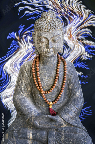Stone Buddha statue, blue and white lights background