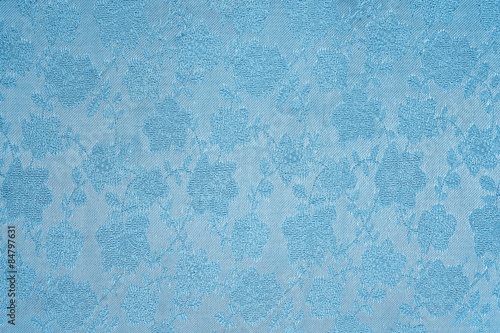 Wallpaper Mural blue background Satin fabric with floral pattern closeup Torontodigital.ca