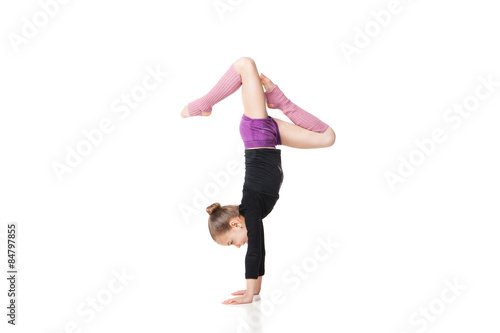 Slika na platnu pretty little girl doing gymnastics over white background
