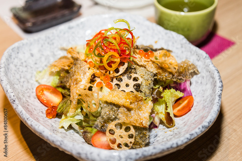 Japanese shake kawa salad with dried salmon skin and lotus roots 