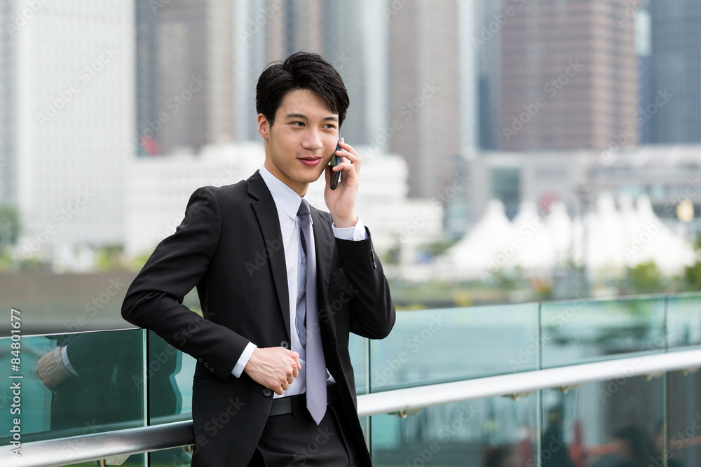 Asian businessman chat on cellphone