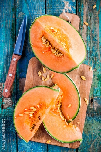 sliced ripe melon on a cutting board