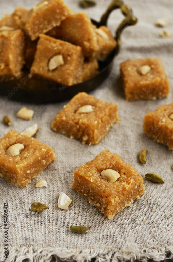 Homemade burfi - traditional indian sweets with coconut flakes,
