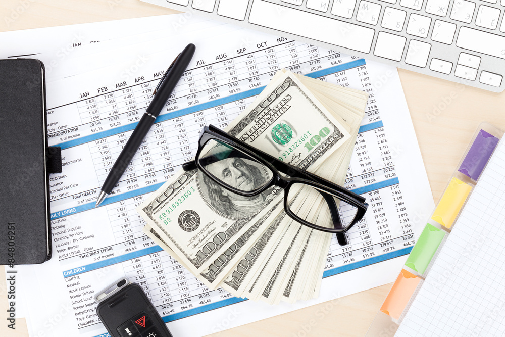 Office table with pc, supplies and money cash Office table with pc, supplies and money cash