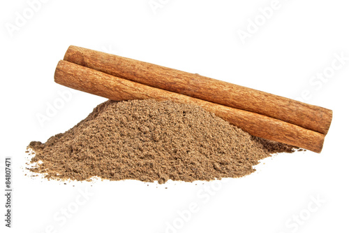 Cinnamon stick and powder on white background
