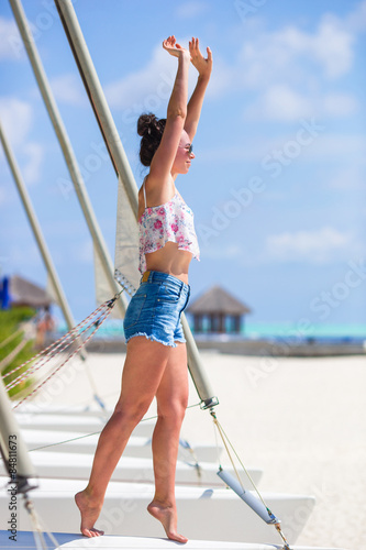 Young beautiful woman during tropical beach vacation © travnikovstudio