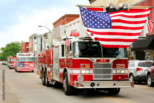 Valokuva Fire Trucks with American Flags at Small Town Parade