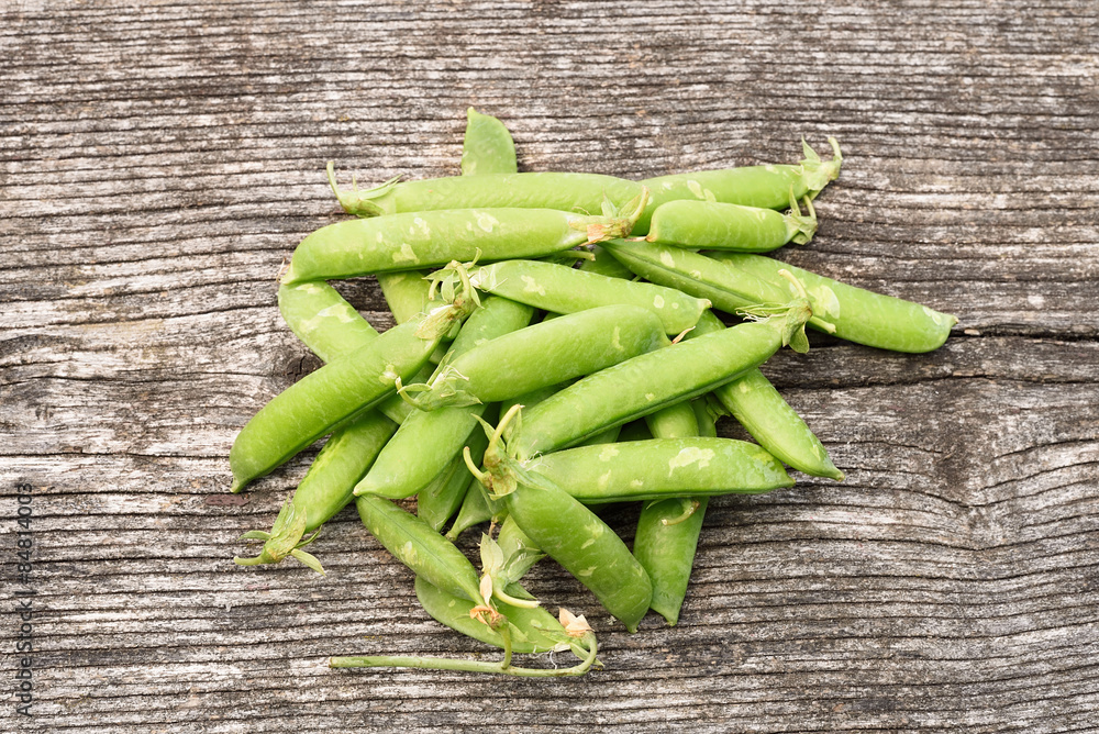 Fresh peas on wooden background Fresh peas on wooden background