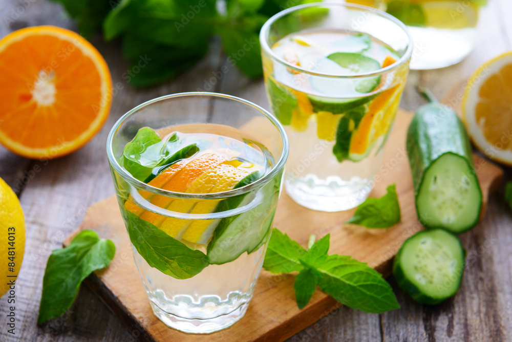 Fototapeta premium Soft drinks with cucumber, orange and lemon