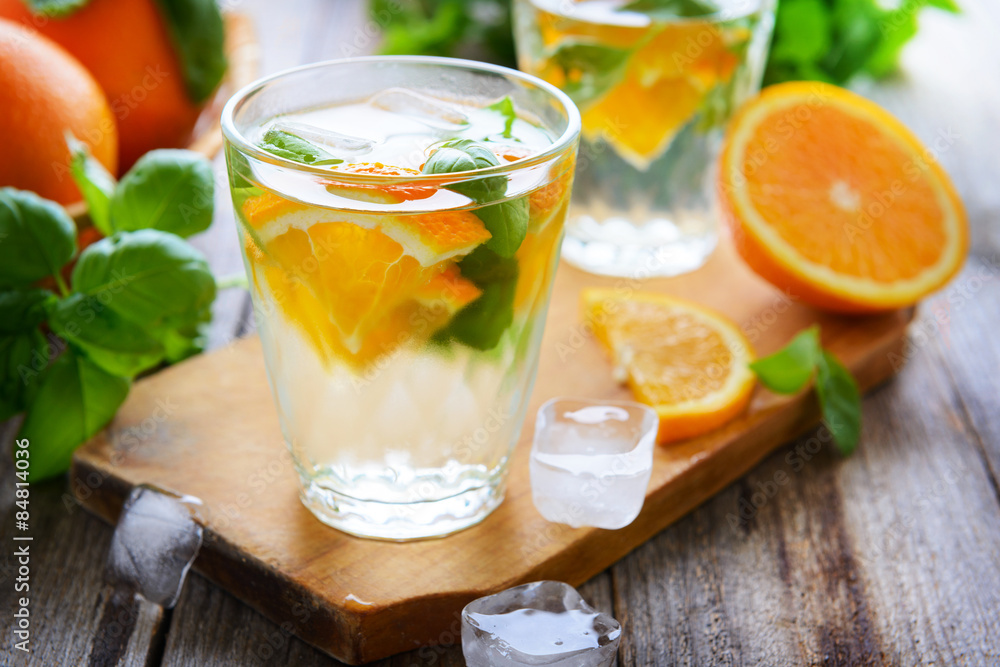 Summer soft drink with orange and basil
