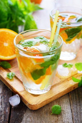 Cold orange drink with basil