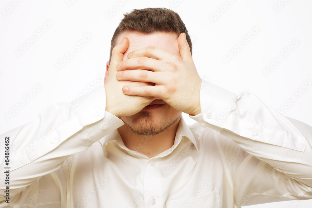 business man cover eyes with his hands business man cover eyes with his hands