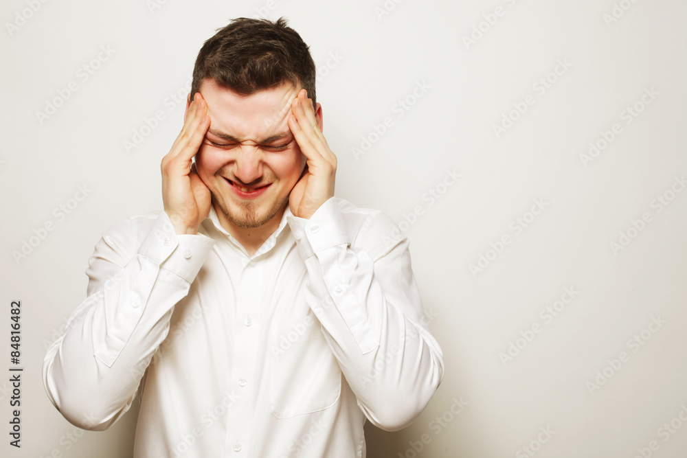 business man with a headache or problem business man with a headache or problem