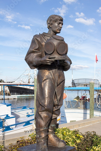 Bronze Sponge Diver - Sculpture of Bronze Sponge Diver Dressed in His Diving Suite and Holding His Metal Diving Helmet