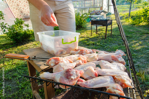 The man was disintegrating meat on the grill photo