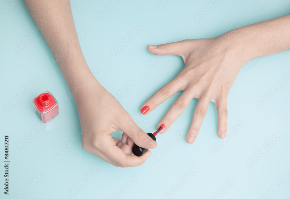 Mani donna con smalto rosso Stock Photo | Adobe Stock