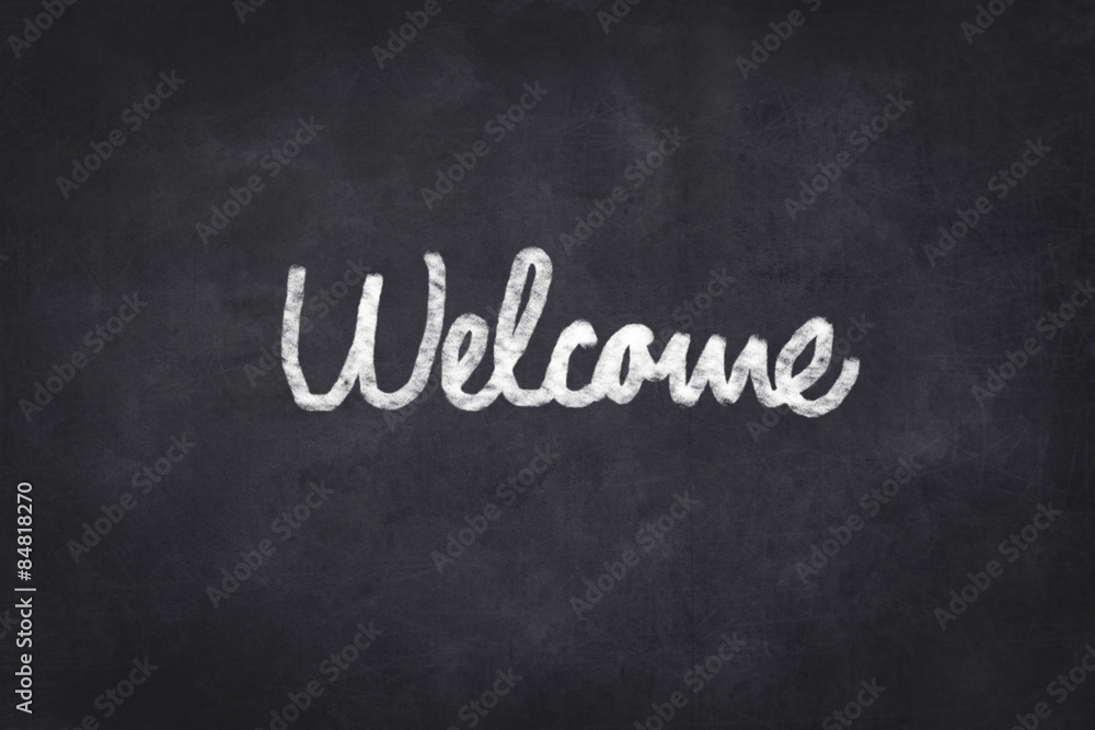 welcome - text on chalkboard , handwritten welcome - text on chalkboard , handwritten