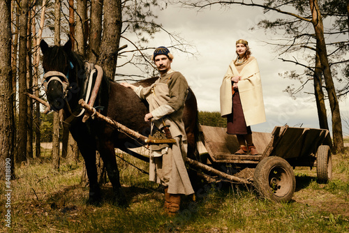woman and man in ethnic suit  context historical reconstruction