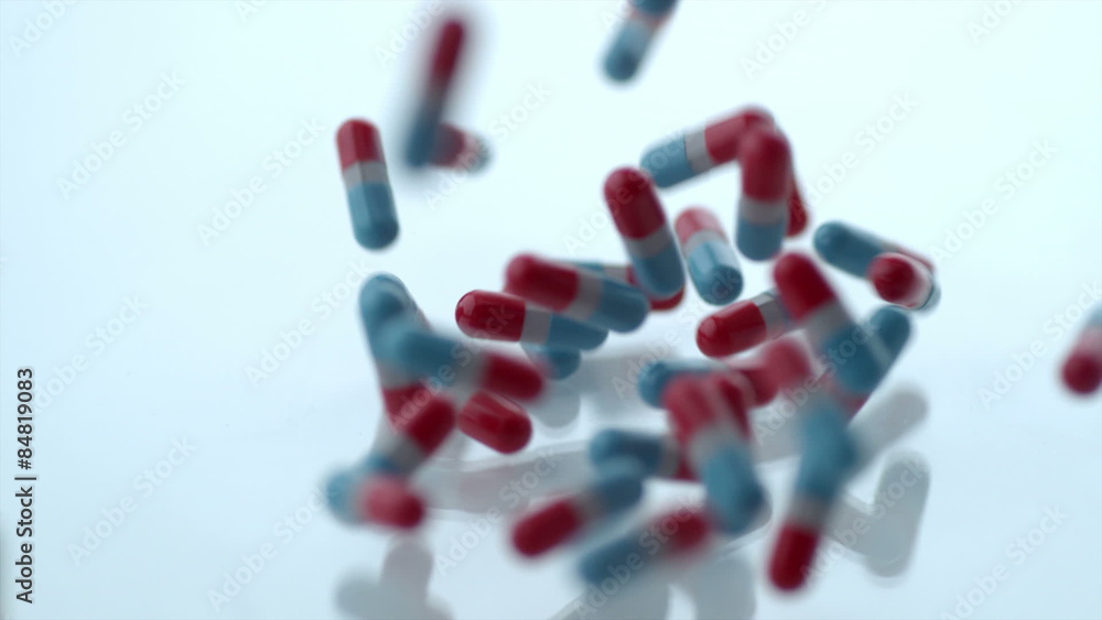Pills falling in slow motion Pills falling in slow motion