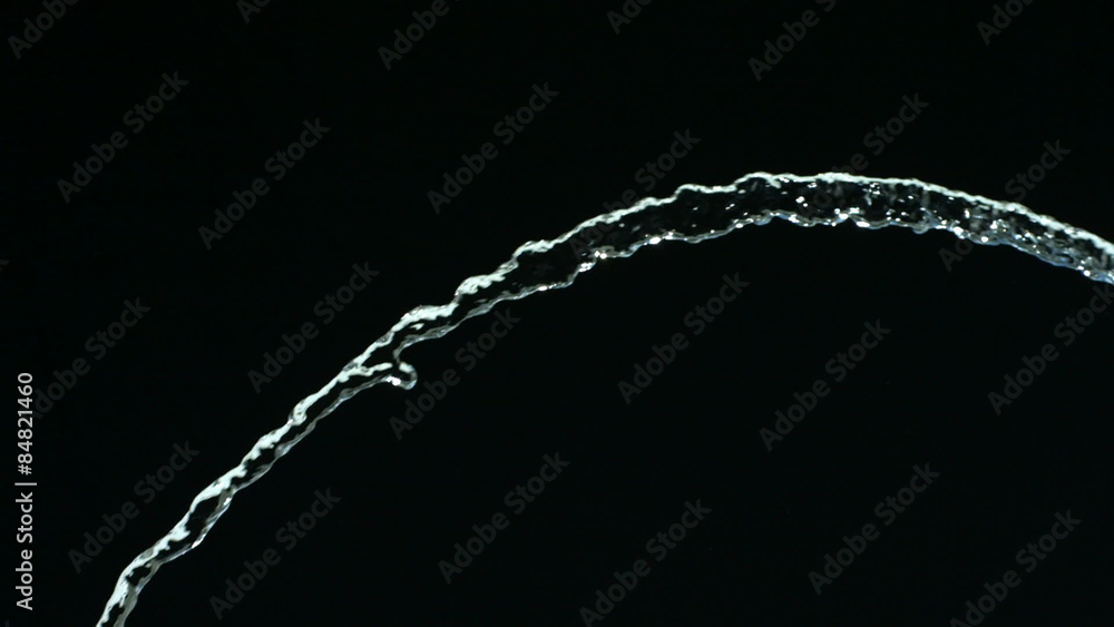 Water flow on black background, slow motion Water flow on black background, slow motion