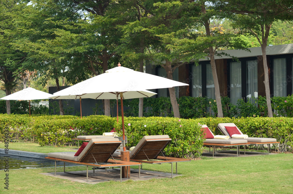 Outdoor daybeds with white parasol