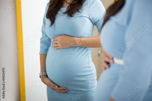 stomach of a pregnant woman, close up