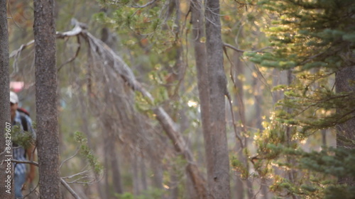Couple backpacking together through woods