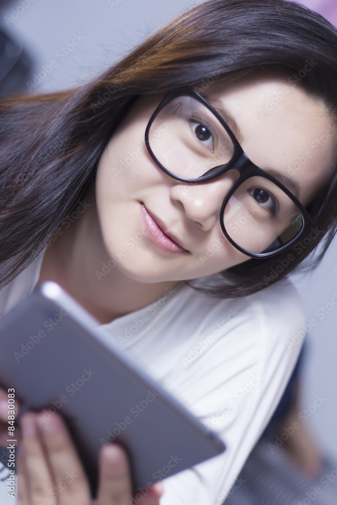 Woman using a tablet at bedroom Woman using a tablet at bedroom